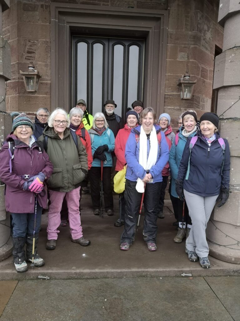 13 members of the Walking Group in a doorway